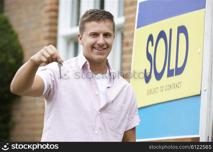Man Outside New Home Holding Keys