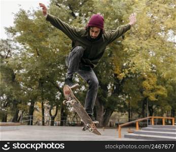 man outside with skateboard
