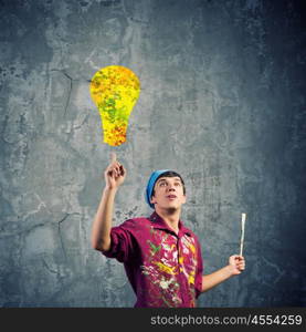 Man painter. Young handsome man painter with brush in hand