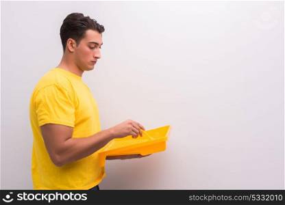 Man painting house in DIY concept