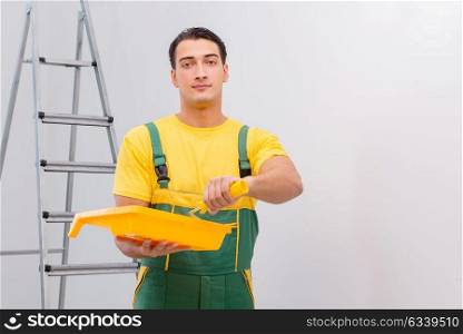 Man painting the wall in DIY concept