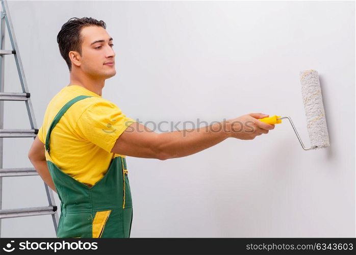 Man painting the wall in DIY concept