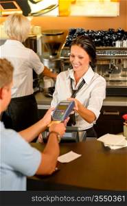 Man paying bill at cafe using card bill happy waitress