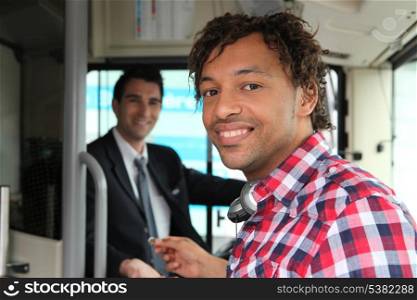 Man paying for bus ticket
