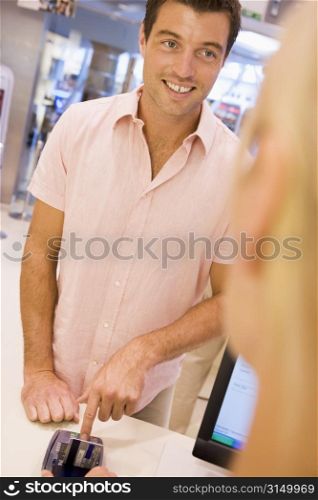 Man paying for purchases with credit card