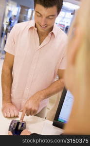 Man paying for purchases with credit card