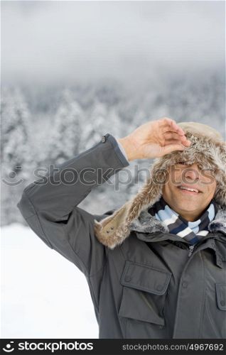 Man peeking through a deerstalker hat
