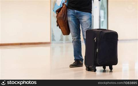 Man people traveling luggage bag he waiting airplane in air port terminal building