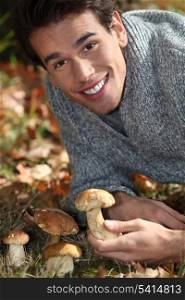Man picking mushrooms