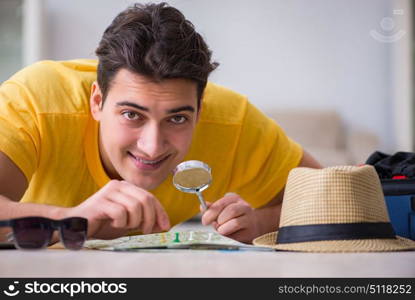 Man planning his vacation trip with map