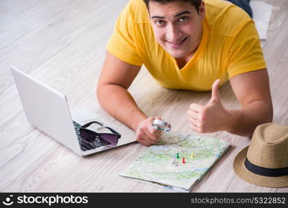 Man planning his vacation trip with map