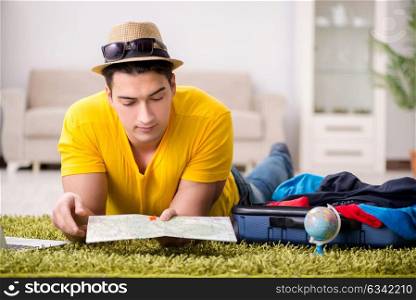 Man planning his vacation trip with map