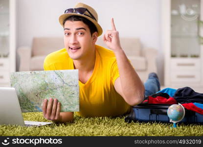 Man planning his vacation trip with map. The man planning his vacation trip with map