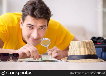 Man planning his vacation trip with map. The man planning his vacation trip with map