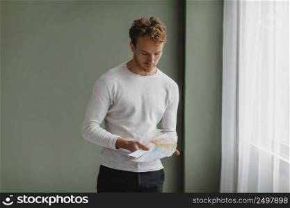 man planning redecorate house using paint palette
