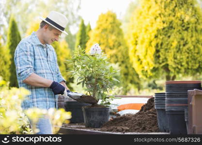 Man planting pot at garden