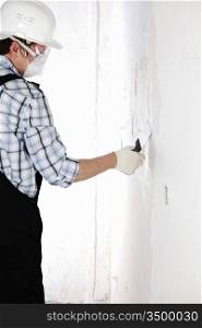 Man plastering a wall