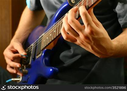 man play solo on blue guitar