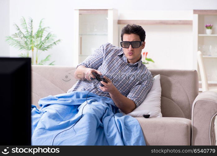 Man playing 3d games at home