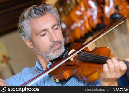 man playing a violin