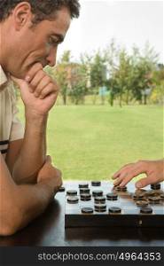 Man playing checkers