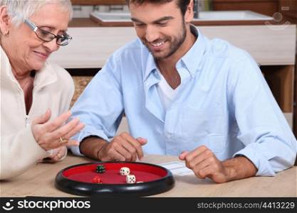 Man playing dice with woman