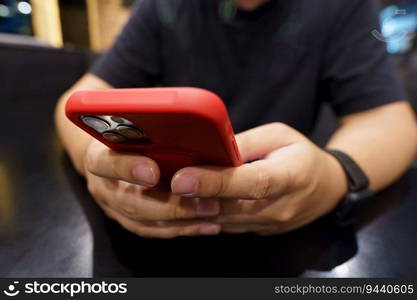 Man playing game on mobile phone. gamer boy playing video games holding Smartphone working mobile devices. cell telephone technology e-commerce concept