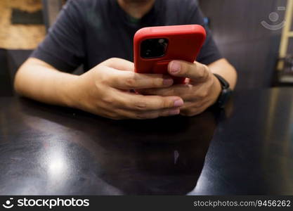 Man playing game on mobile phone. gamer boy playing video games holding Smartphone working mobile devices. cell telephone technology e-commerce concept