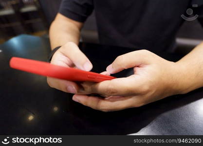 Man playing game on mobile phone. gamer boy playing video games holding Smartphone working mobile devices. cell telephone technology e-commerce concept