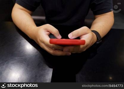 Man playing game on mobile phone. gamer boy playing video games holding Smartphone working mobile devices. cell telephone technology e-commerce concept