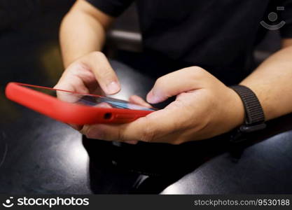 Man playing game on mobile phone. gamer boy playing video games holding Smartphone working mobile devices. cell telephone technology e-commerce concept