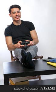 man playing games. a young man with black tshirt playing games in a game console computer