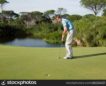 Man playing golf on golf course