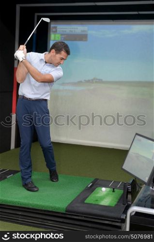 man playing golf video-game