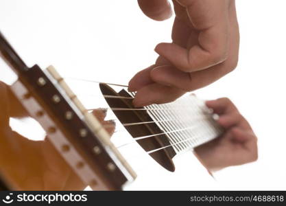 Man playing guitar. Close up of male hands playing acoustic guitar