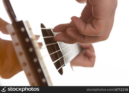 Man playing guitar. Close up of male hands playing acoustic guitar