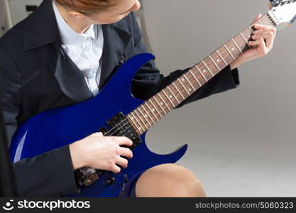 Man playing guitar. Close up of male hands playing electric guitar