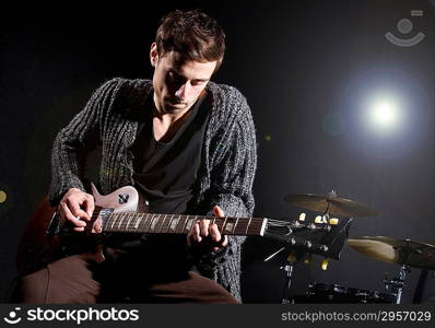 Man playing guitar during concert