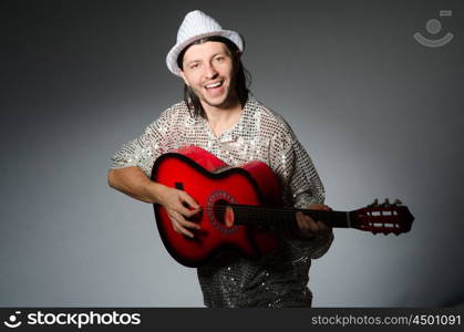 Man playing guitar during concert