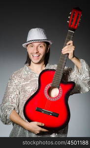 Man playing guitar during concert