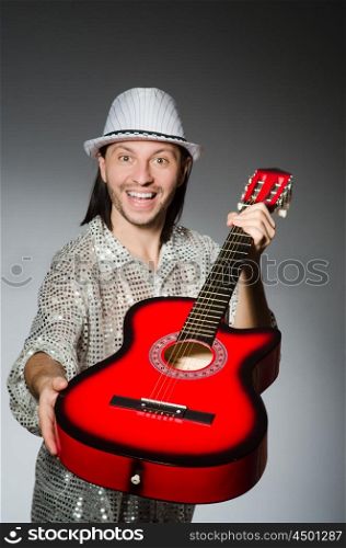 Man playing guitar during concert