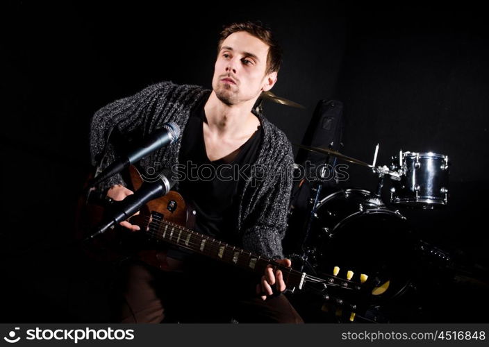 Man playing guitar during concert