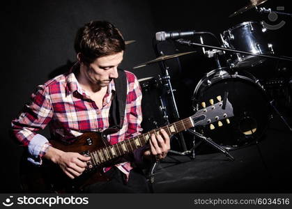 Man playing guitar during concert