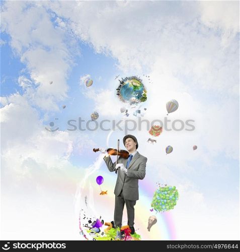 Man playing holiday melody. Funny man in hat playing violin presenting celebration concept. Elements of this image are furnished by NASA