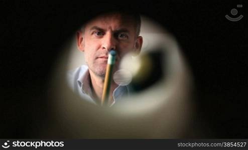 man playing pool game. Viewed from inside hole. 30p