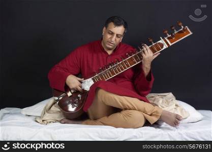 Man playing the sitar