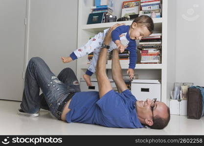 Man playing with his son