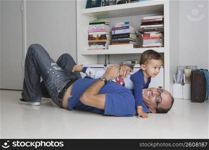 Man playing with his son