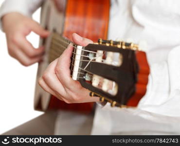 man plays on classical acoustic guitar close up isolated on white background