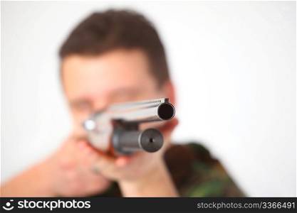 man pointed from gun, focus on muzzle